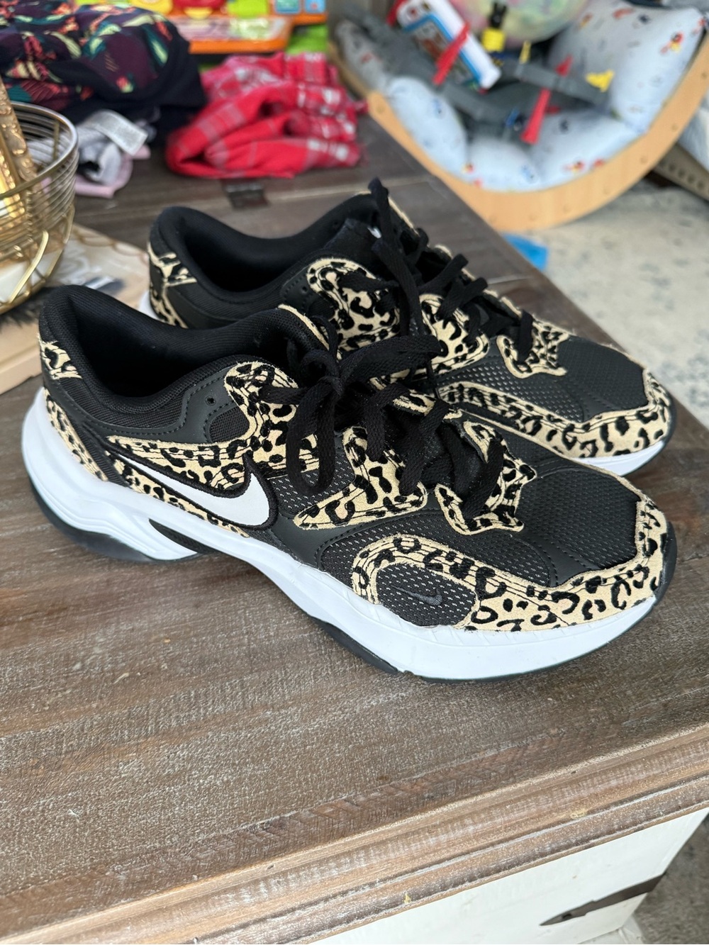 Nike Women's Black Sneakers with Beige Leopard Accents and White Sole